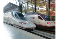 Estación de tren, con dos trenes saliendo de una estación.