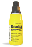   Bote de antiséptico Betadine. (Bote amarillo, con tapón negro).